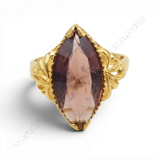 22ct gold and amethyst toned glass (facetted lozenge slightly abraded) ring. Size J. 3.95gms.