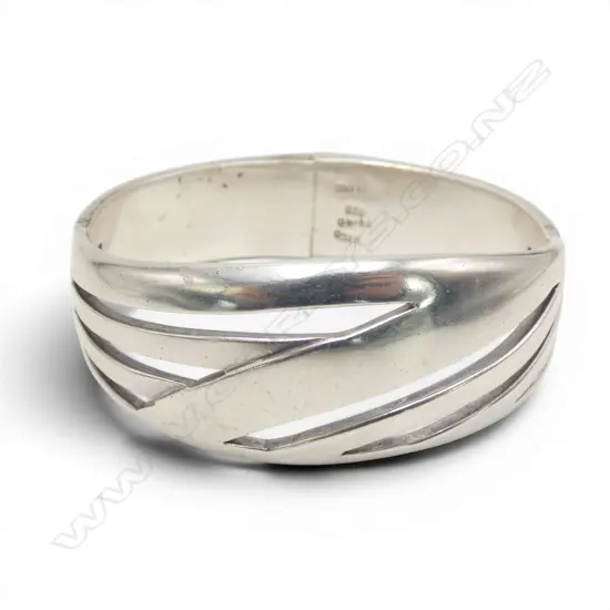 STG SILVER HEAVY SOLID HINGED BANGLE broad pierced bars. 80gms.