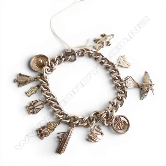 STG SILVER CHARM BRACELET 57gms