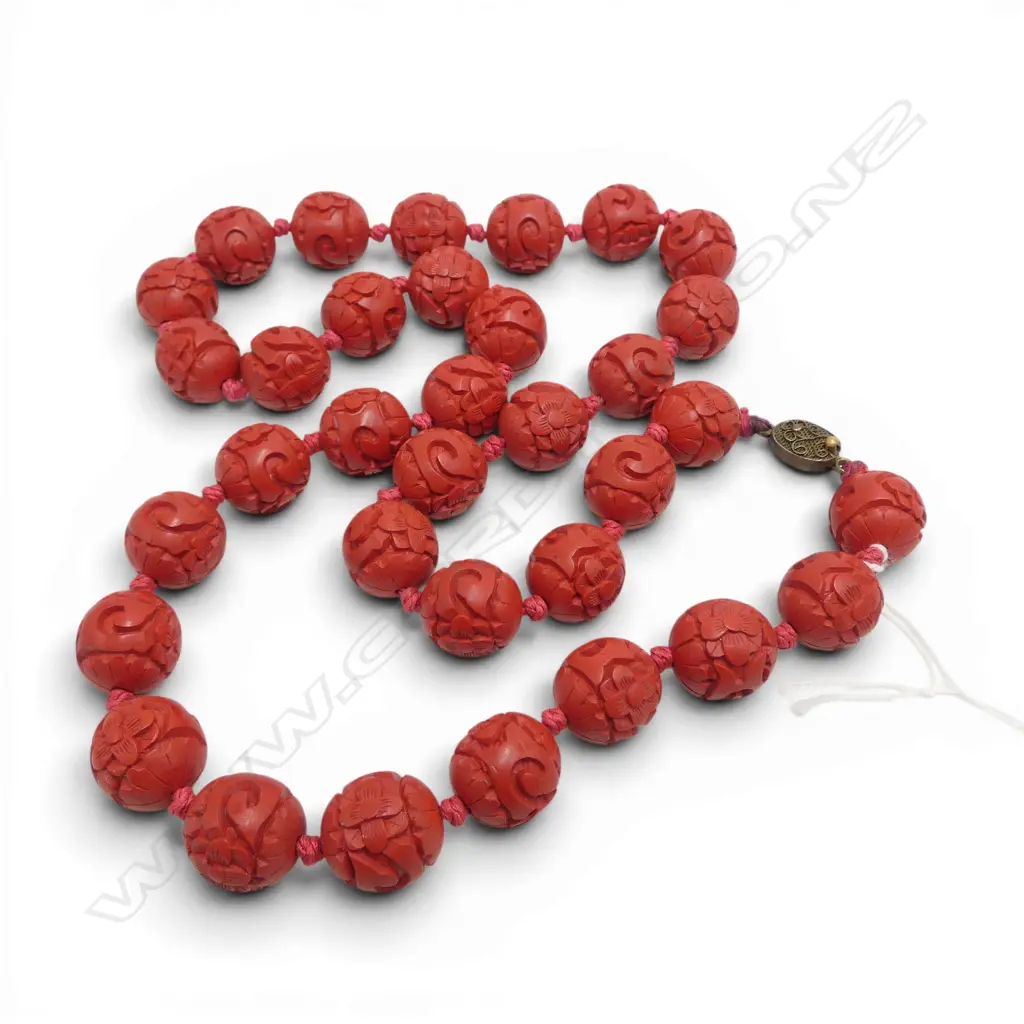 NECKLACE OF OLD CINIBAR LACQUER TYPE CARVED BEADS uniform size individually knotted. L.640mm. Image 1++