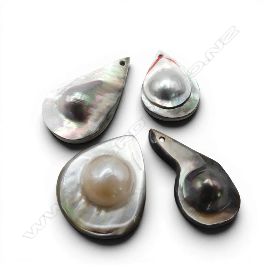 FOUR MABE PEARLS (From the estate of jeweller Simon Misdale) Image 1++