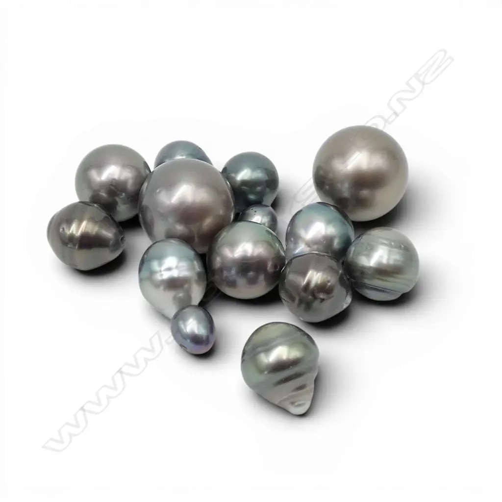 SEVEN PAIRS OF COOK ISLAND BLACK PEARLS (From the estate of jeweller Simon Misdale) Image 1++