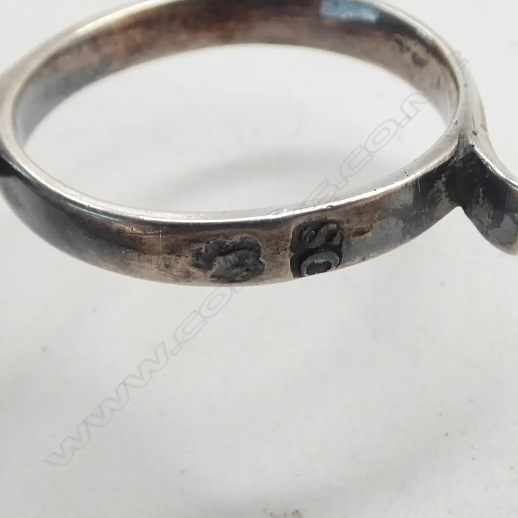Pair early George III silver sugar nips. Shell bowls. Ring handles. 26gms. Image 1++