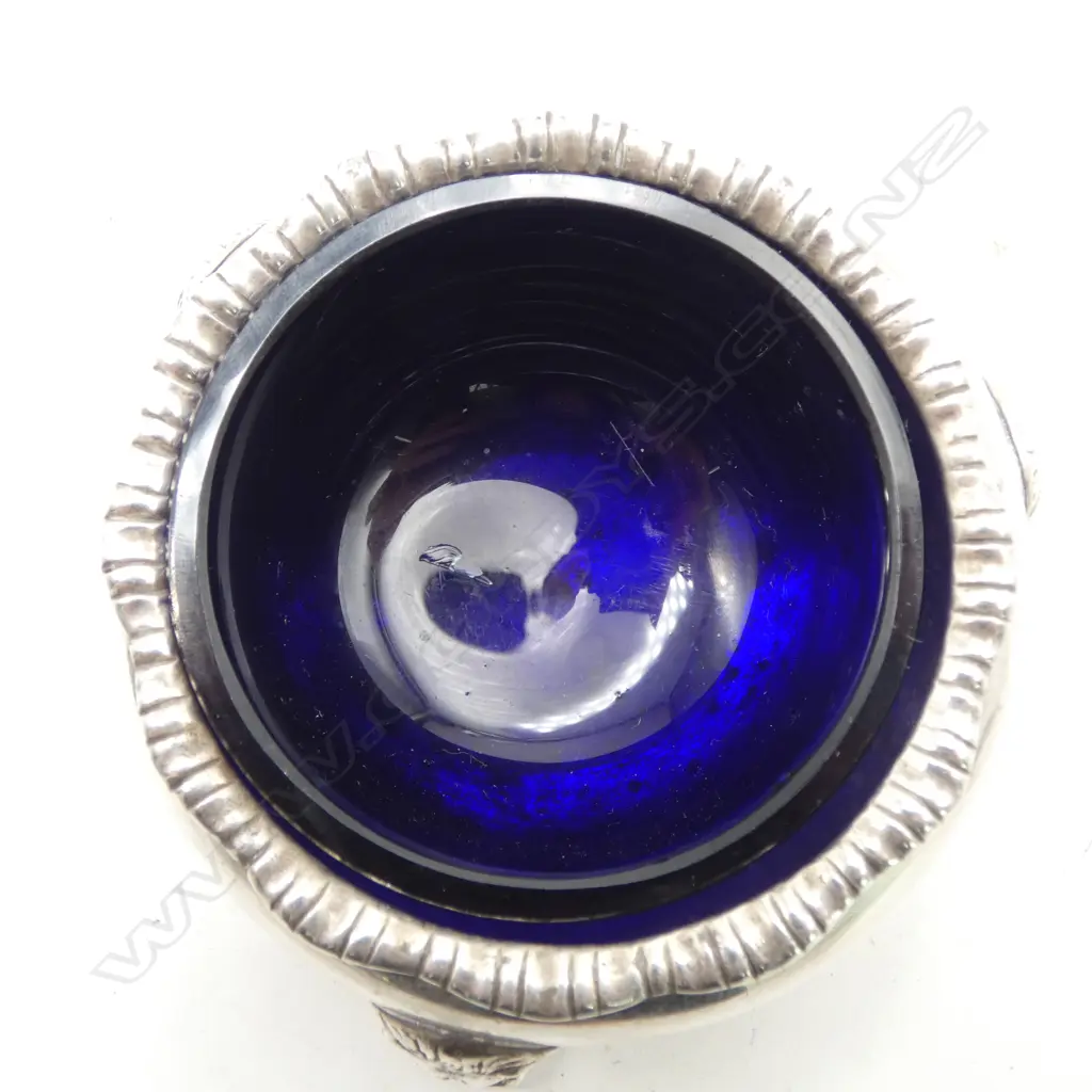 # Pair of silver salts w blue glaze liners. Birmingham 1931. Lion's mask feet mounts. 174gms silver. Image 1++