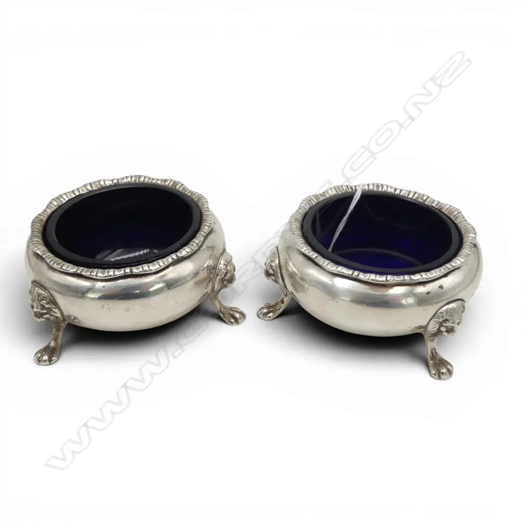 # Pair of silver salts w blue glaze liners. Birmingham 1931. Lion's mask feet mounts. 174gms silver. Image 1++
