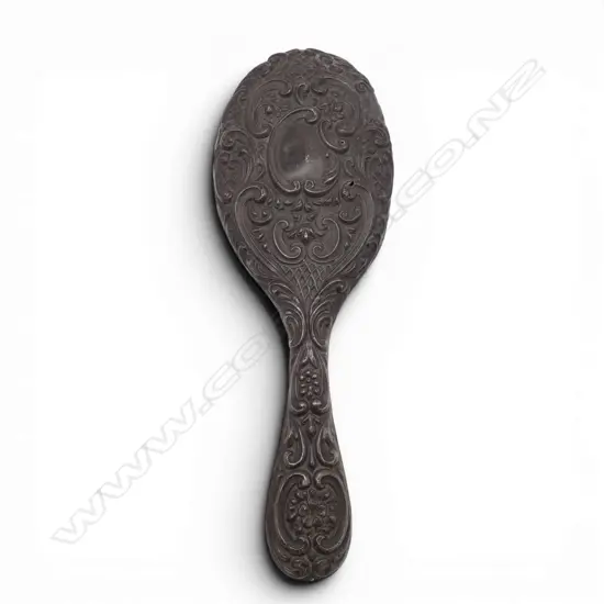 SILVER EMBOSSED HAND MIRROR Birmingham 1904. A few dents. H.250mm