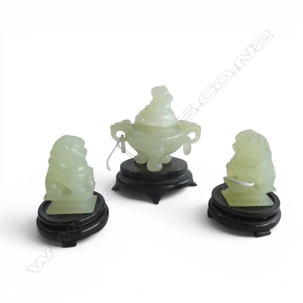 3 CHINESE PALE GREEN SMALL CARVINGS: PR SEATED LIONS on stands + lidded censor lion finial & mask & ring handles. H.90mm Image 1++