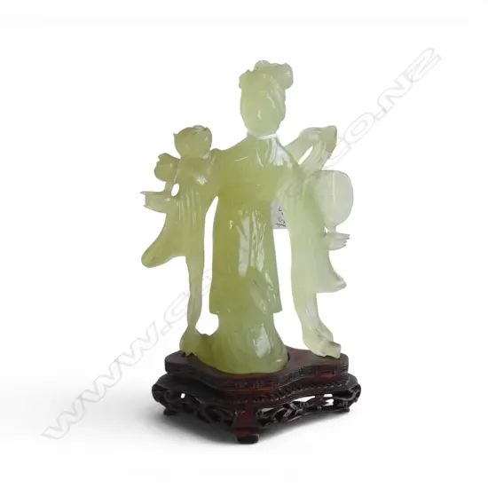 CHINESE PALE GREEN JADE CARVING OF A WOMAN standing in trad. robes w ribbon wrap fan & florals. Fingers faulted. H.215mm