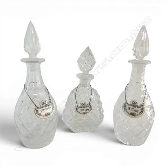 3 CRYSTAL DECANTERS (few small chips) w. PORCELAIN LABELS H.300mm