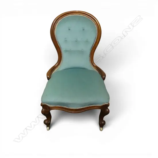 VICTORIAN MAHOGANY GRANDMOTHER CHAIR on white porcelain casters.