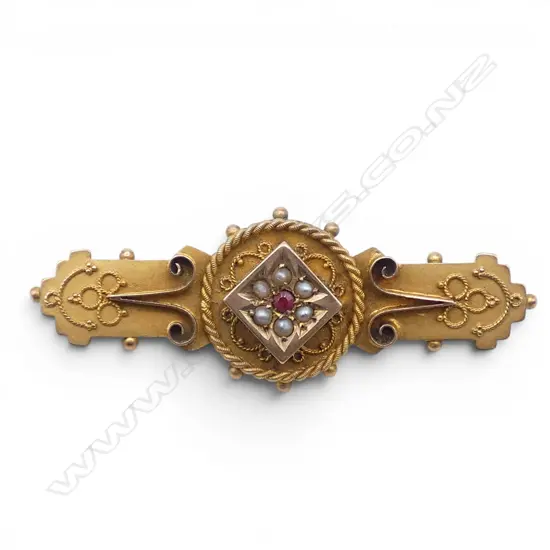 C.1900 9ct GOLD RUBY & SEEDPEARL BROOCH with fine wire twist highlights. 3.45gms.