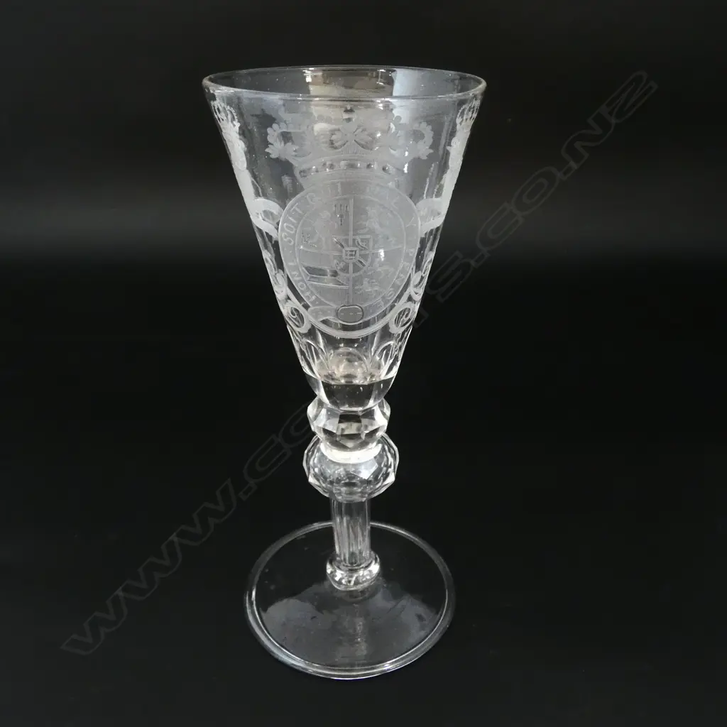 An 18thC soda drinking glass engraved with the British coat of arms double faceted knopped hollow stem wide spreading foot. H.182mm. Image 1++