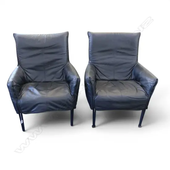2 BLACK LEATHER ARMCHAIRS w. ZIPPER DETAIL