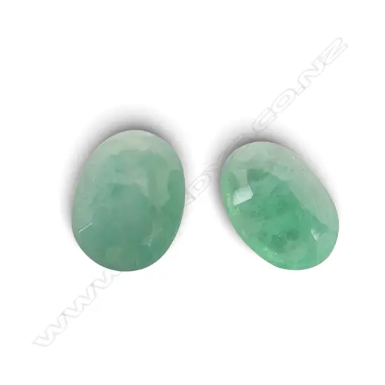 2 LOOSE OVAL CUT EMERALDS, inclusions
