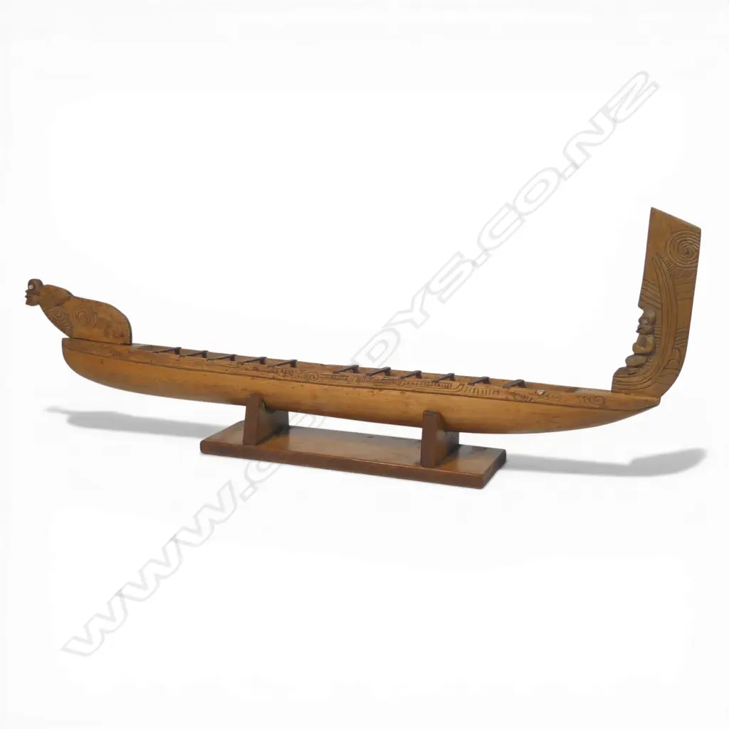 A mid/late 20thC Māori native carved wood model waka on stand, Image 1++