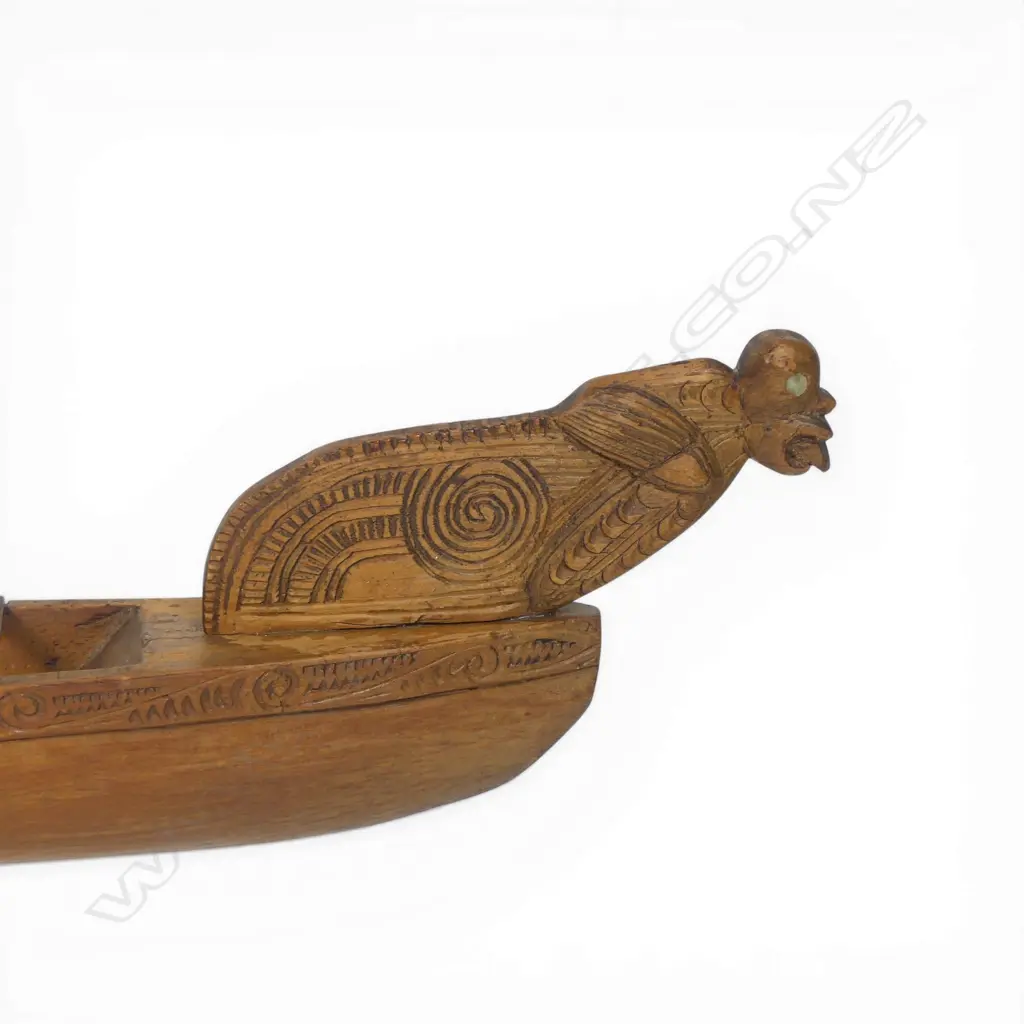 A mid/late 20thC Māori native carved wood model waka on stand, Image 1++