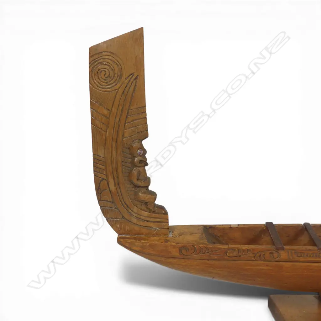 A mid/late 20thC Māori native carved wood model waka on stand, Image 1++