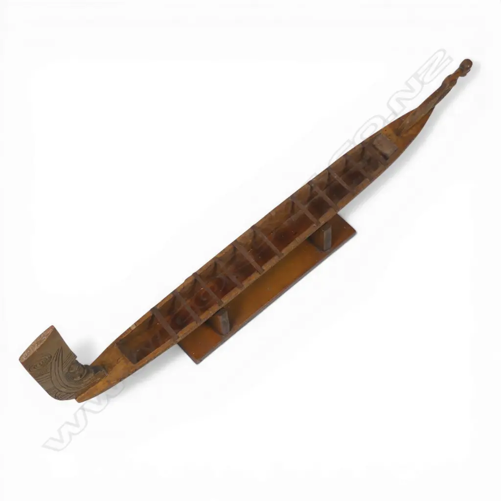 A mid/late 20thC Māori native carved wood model waka on stand, Image 1++