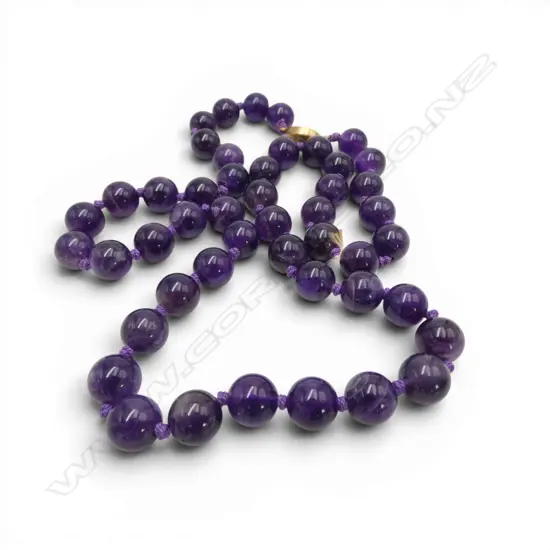 A vintage strand of uniformed polished amethyst beads fitted with fillagree silver gilt clasp. L.620mm