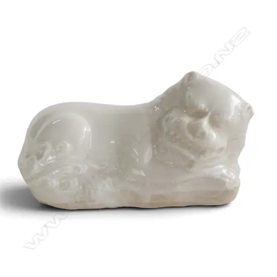 CHINESE WHITE PORCELAIN FU DOG label to base reading 'A Late Ming Dynasty' L.110mm