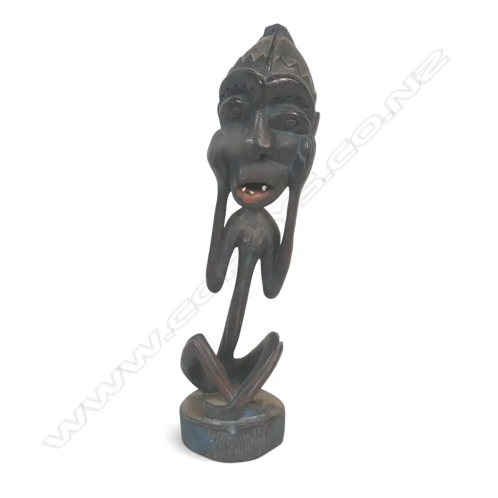 EAST AFRICAN DARK WOOD CARVING A OF SPIRIT (SHETANI IN SWAHILI) WITH AN EXAGGERATED EXPRESSION, BLUE PATINA,450 X 110MM Image 1++