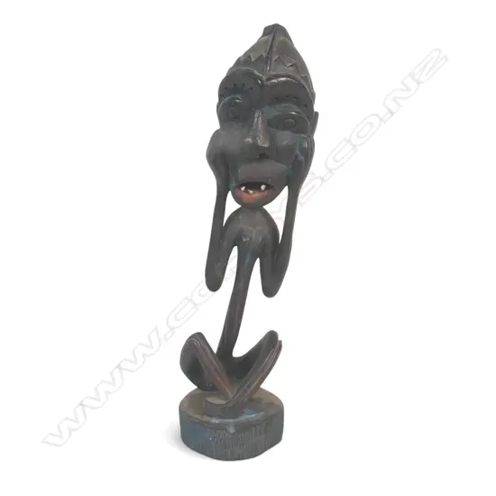 EAST AFRICAN DARK WOOD CARVING A OF SPIRIT (SHETANI IN SWAHILI) WITH AN EXAGGERATED EXPRESSION, BLUE PATINA,450 X 110MM