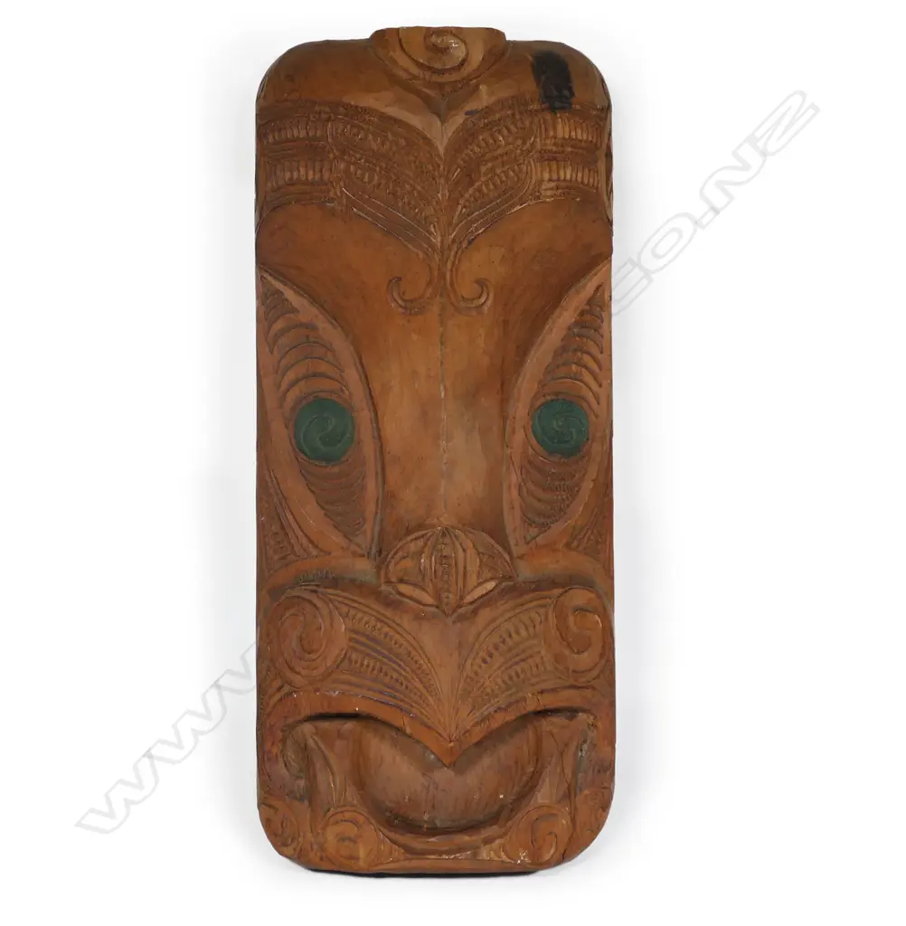 Mid/late 20thC Māori carved gable mask, green staining to the double spiral carved eyes. H.450mm. Image 1++