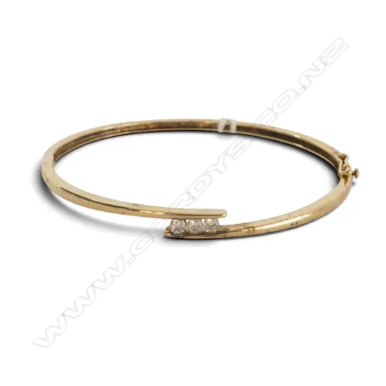 9CT GOLD AND THREE DIAMOND BANGLE 4.18gms