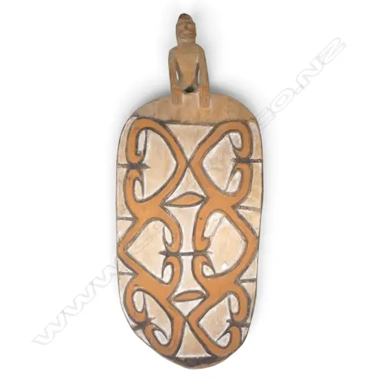 CARVED WOODEN ASMAT SHIELD WITH ANCESTOR FIGURE HANDLE AND OCHRE PIGMENTS, SOUTH PAPUA.H.900 X 360MM