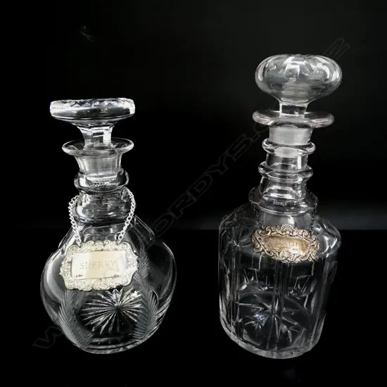 2 CRYSTAL DECANTERS w. sherry label & stg silver brandy label 10gms