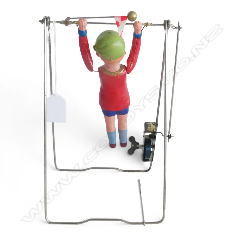 VINTAGE CELLULOID YOUNG GIRL ON BAR 'Kikaitaiso' swinging clock work TOY: Gymnast acrobat toy. c.1930 Image 1++