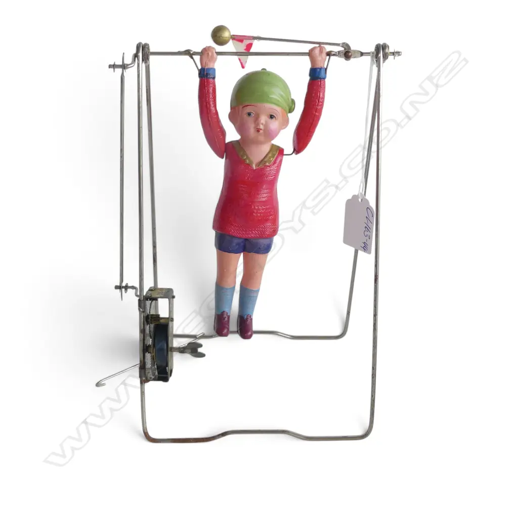 VINTAGE CELLULOID YOUNG GIRL ON BAR 'Kikaitaiso' swinging clock work TOY: Gymnast acrobat toy. c.1930 Image 1++