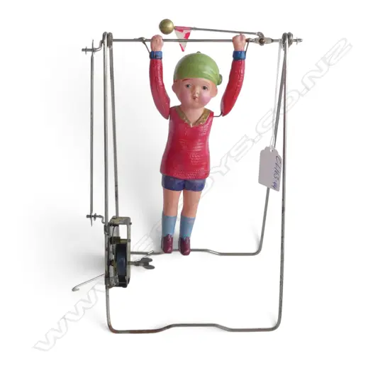 VINTAGE CELLULOID YOUNG GIRL ON BAR 'Kikaitaiso' swinging clock work TOY: Gymnast acrobat toy. c.1930