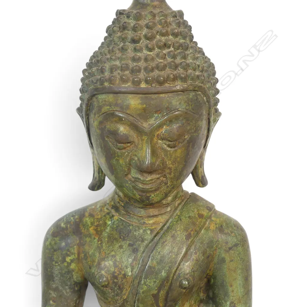 SOUTHEAST ASIAN SEATED BRONZE BUDDHA WITH DARK GREEN PATINA IN MEDITATIVE POSE (MUDRA), CLAY FILLING THE BASE. H.280MM Image 1++