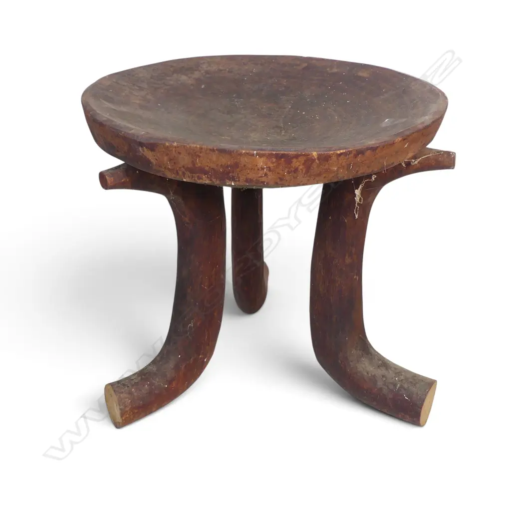 ETHIOPIAN (JIMMA PEOPLE) CARVED TRIPOD WOODEN STOOL WITH DISTINCT HORN SHAPED CURVED LEGS.H.370MM DIA 390MM Image 1++