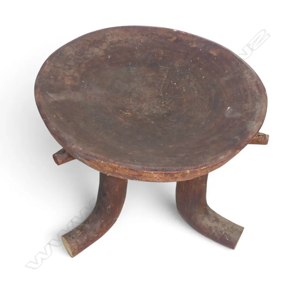 ETHIOPIAN (JIMMA PEOPLE) CARVED TRIPOD WOODEN STOOL WITH DISTINCT HORN SHAPED CURVED LEGS.H.370MM DIA 390MM Image 1++
