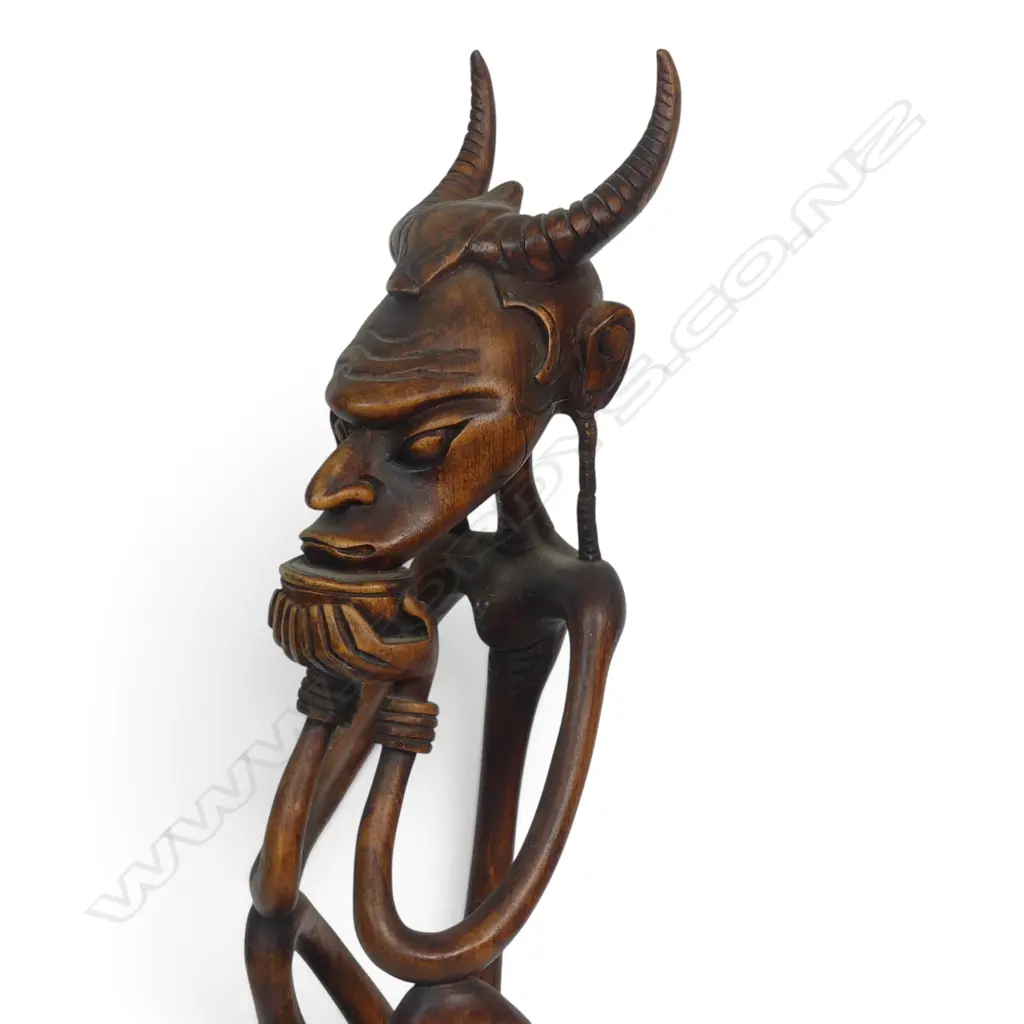 STYLIZED HAND CARVED WOODEN TRIBAL SCULPTURE OF A SEATED HORNED ANCESTOR, 470 X 130MM Image 1++