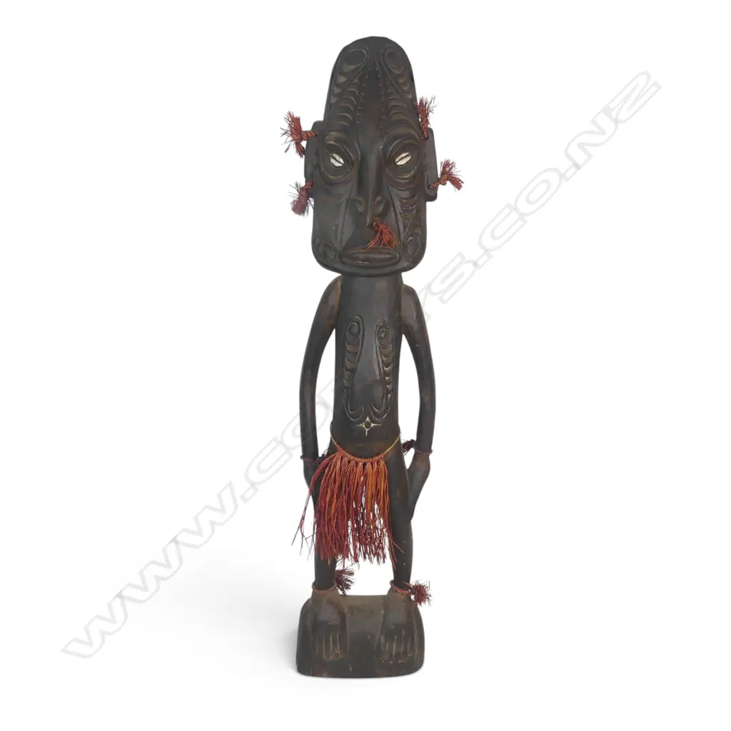 HAND CARVED WOODEN PNG STANDING SPIRIT FIGURE, COWRIE SHELL EYES FIBER AND RAFFIA. H.650MM Image 1++