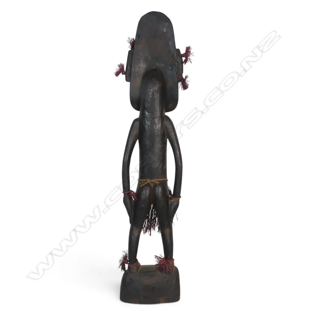 HAND CARVED WOODEN PNG STANDING SPIRIT FIGURE, COWRIE SHELL EYES FIBER AND RAFFIA. H.650MM Image 1++