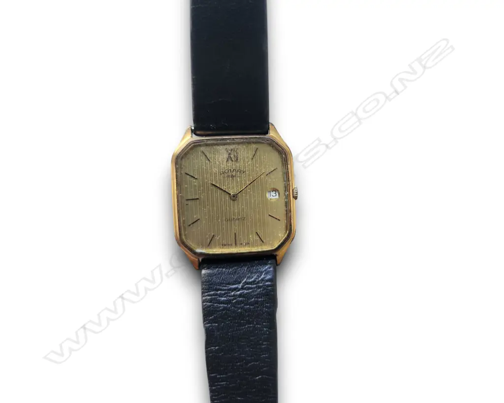 VINTAGE GOLD-TONE QUARTZ DRESS WATCH W A TEXTURED DIAL, DATE WINDOW, BLACK LEATHER STRAP, ORIGINAL ROTARY BOX Image 1++