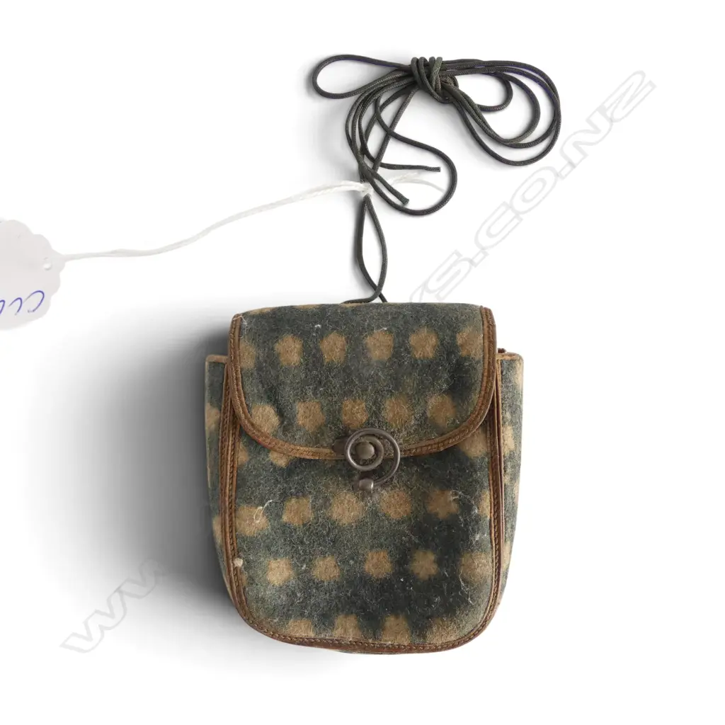 A c.1900 small felt purse. Rosette patterned. Silvered wire fitting. Cord handle. H.75mm. Image 1++