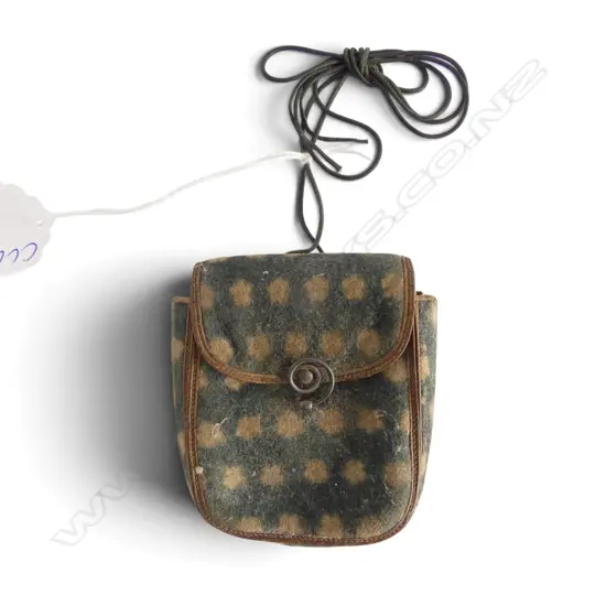 A c.1900 small felt purse. Rosette patterned. Silvered wire fitting. Cord handle. H.75mm.