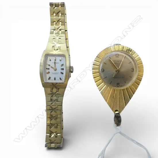 2 VINTAGE WATCHES: Ladies Titan + Citron pendant watch. Both gilded. Apparently running
