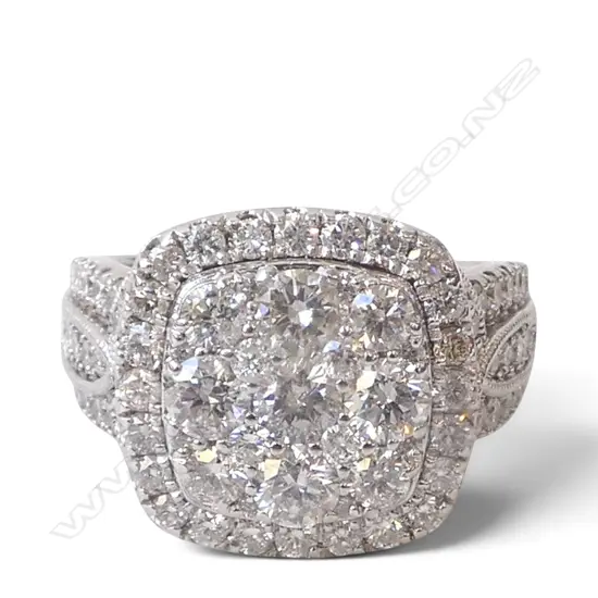 # A 10ct white gold and large diamond cluster ring, TDW. 3cts. SIZE T