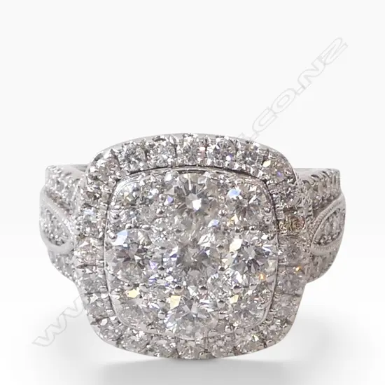 # A 10ct white gold and large diamond cluster ring, TDW. 3cts. SIZE T