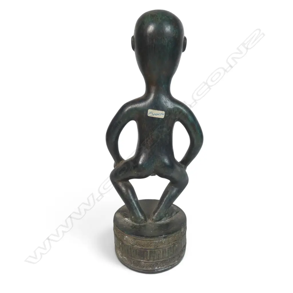 BRONZED SCULPTURE FROM THE DAYAK PEOPLE OF BORNEO OF AN HAMPATONG ANCESTRAL GUARDIAN IN CROUCHED POSTURE, 100 X 320MM Image 1++