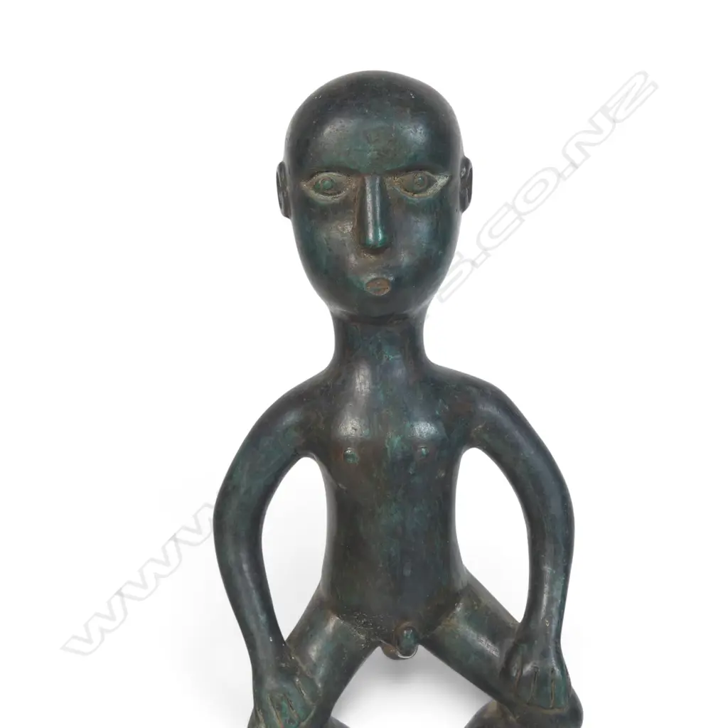 BRONZED SCULPTURE FROM THE DAYAK PEOPLE OF BORNEO OF AN HAMPATONG ANCESTRAL GUARDIAN IN CROUCHED POSTURE, 100 X 320MM Image 1++