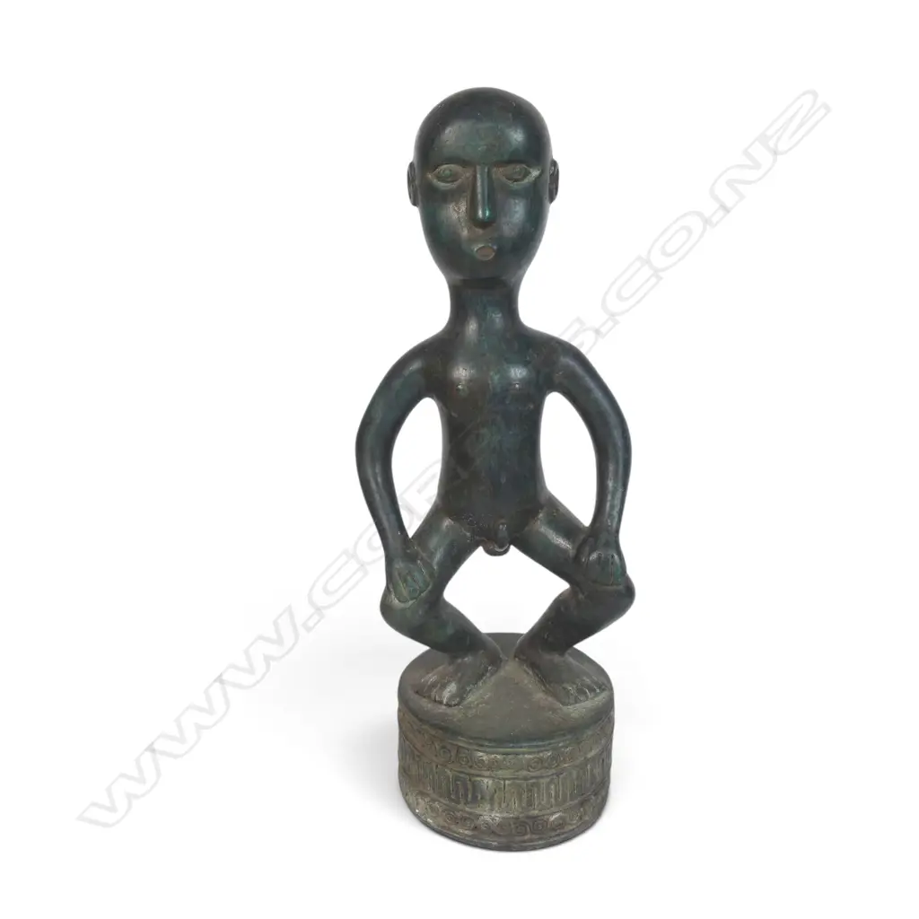 BRONZED SCULPTURE FROM THE DAYAK PEOPLE OF BORNEO OF AN HAMPATONG ANCESTRAL GUARDIAN IN CROUCHED POSTURE, 100 X 320MM Image 1++