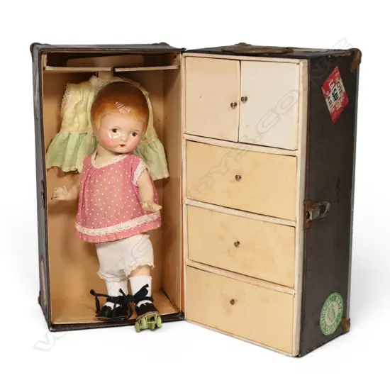 An uncommon vintage American skater doll with original travel case,