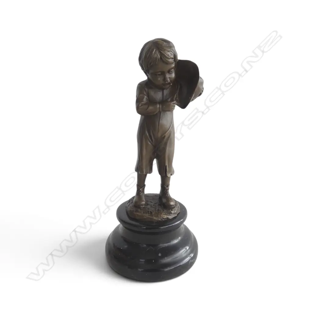 Contemporary bronze 'The Smoker Boy' signed 'Nick' on black marble base. H.215mm. Shielding the flame with his hat. Image 1++